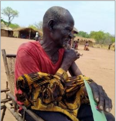 Elderly man in Kozi, happy to receive the COVID-19 vaccine